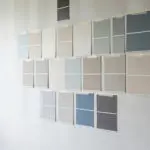 Interior paint color samples on a wall showing interior paint colors that make cold rooms feel warmer through soft neutrals and warm undertones