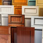 Popular cabinet styles for kitchens in Grand Rapids shown through a variety of painted and stained cabinet door designs, including shaker, raised panel, and modern flat-panel styles displayed side by side.