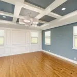 Dining room with blue accent walls and white trim showcasing the best interior paint finish for each room in your home