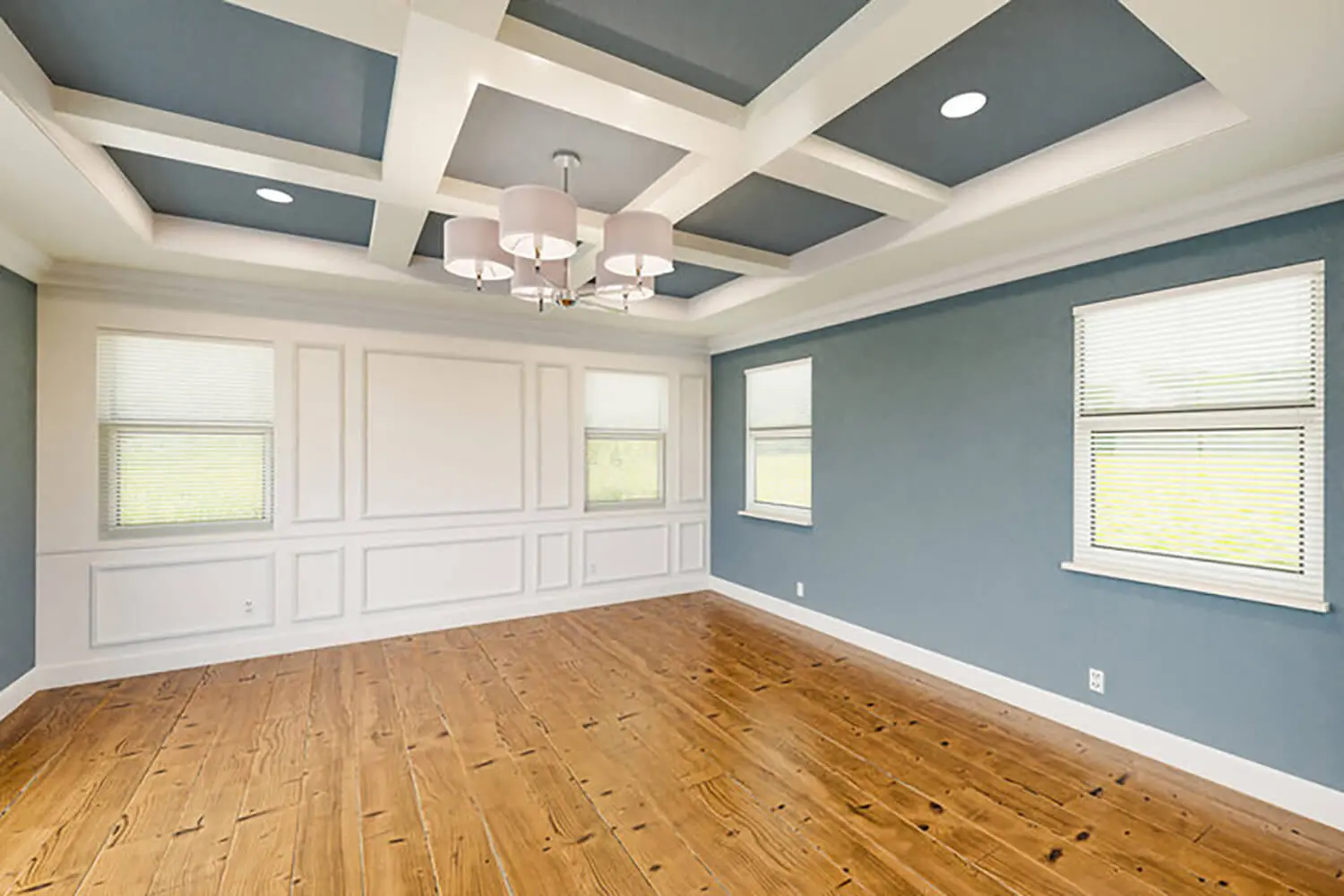 Dining room with blue accent walls and white trim showcasing the best interior paint finish for each room in your home