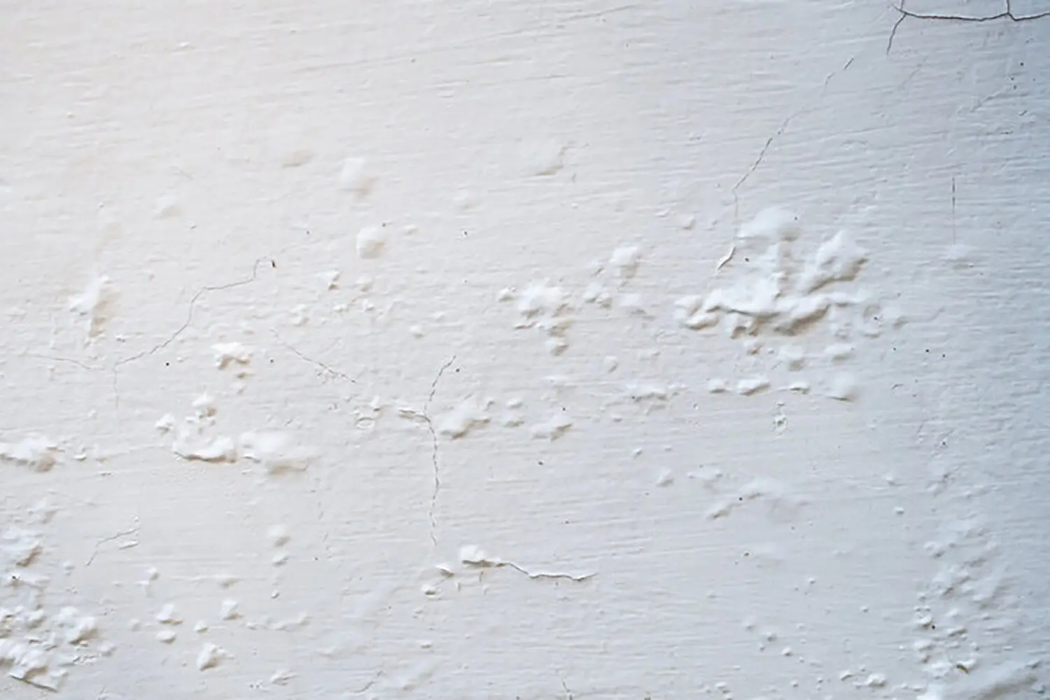 how humid weather affects interior paint causing bubbling and surface defects on an interior wall
