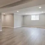 Freshly painted interior room showing the result of how to prepare your home for an interior painting project with clean walls and open space for painting work.