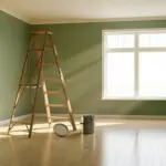 Freshly painted green room with ladder and paint cans, showing what to expect during a professional interior painting project