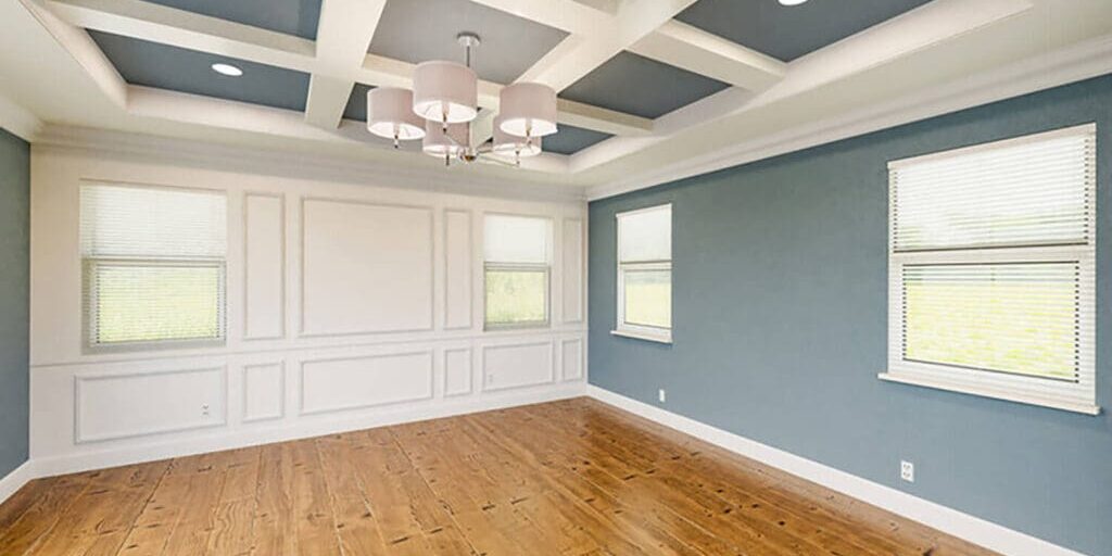 Dining room with blue accent walls and white trim showcasing the best interior paint finish for each room in your home