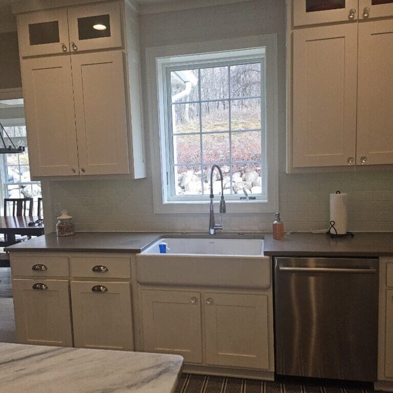 White kitchen cabinets before cabinet refacing in Ada MI home